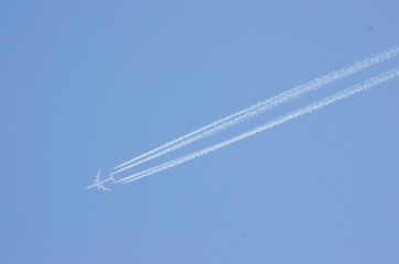 airplane and contrail in the sky