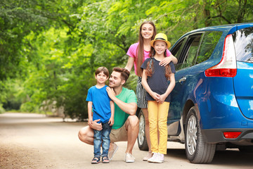 Happy family near car outdoors