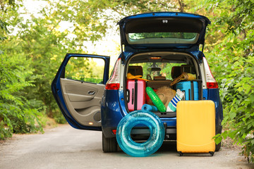 Modern car with luggage outdoors