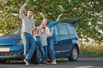 Happy family near car outdoors