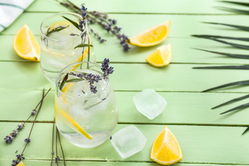 Glasses with lavender lemonade on wooden table