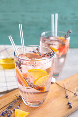 Glass with lavender lemonade on table