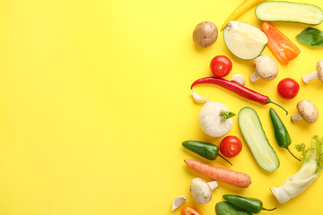 Different fresh vegetables on color background