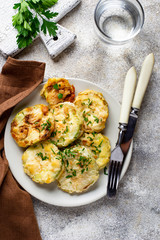 Fried zucchini slices with parsley