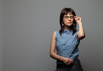 young woman isolated on gray background