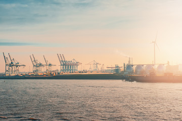 Fototapeta na wymiar Port of Hamburg against of setting sun