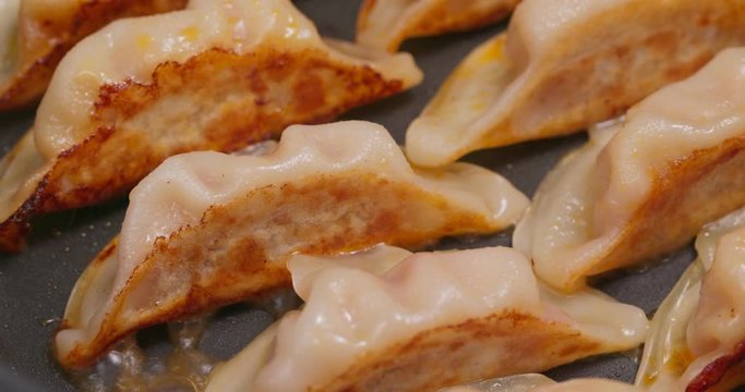 Fry meat dumpling on pan