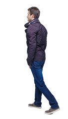 Naklejka premium Side view of going handsome man in jeans and jacket.