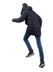 Back view of a running man in winter jacket.