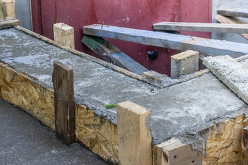 Pouring the concrete base of the house. Formwork Home construction. Technology pouring concrete. Restoration of formwork of a multi-storey building.