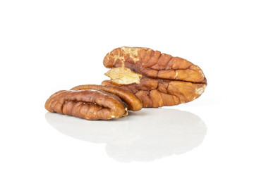 Group of two whole fresh brown pecan nut half isolated on white background