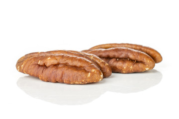Group of two whole healthy fresh brown pecan nut half isolated on white background