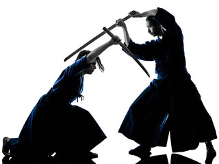 caucasian man and woman practicing laido Katori Shinto ryu isolated shadow silhouette on white...