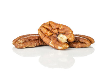 Group of three whole fresh brown pecan nut half isolated on white background