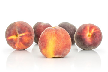 Group of five whole fresh red peach isolated on white background