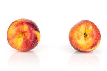 Group of two whole fresh red nectarine isolated on white background