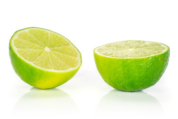 Group of two halves of fresh green lime isolated on white background