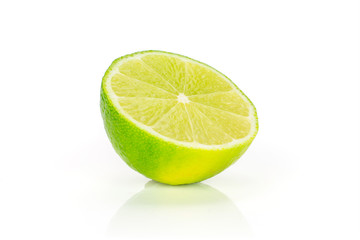 One half of fresh green lime isolated on white background