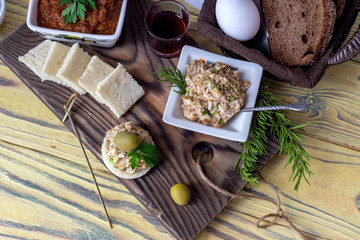 Varied, fresh, tasty snacks and aperitif on wooden table close-up
