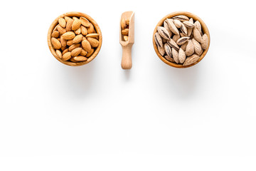 Healthy snack with almonds on white background top view mock up