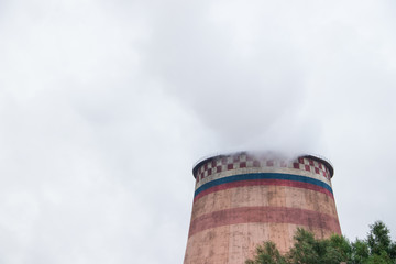 Smoke from the pipe of a thermal power plant. Smoke in the sky. Air pollution. Bad ecology.