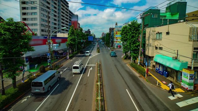 A timelapse of downtown street at Kanpachi avenue in Tokyo daytime wide shot