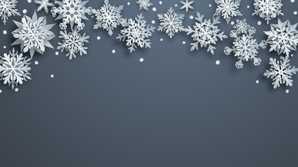 Christmas illustration of white complex paper snowflakes with soft shadows on gray background