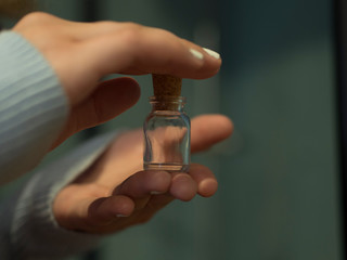 Woman Holding Glass Bottle