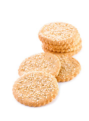 group of cookies with grains of sugar and sesame seeds close-up isolated on white background 