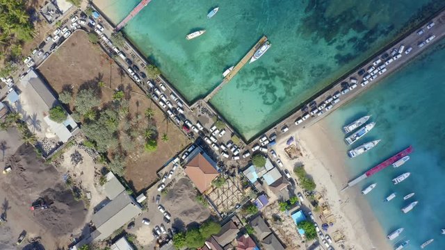 Zoom in Top Down Drone Shot of Cars Entering Nusa Penida Island via Toya Pakeh Harbour. Bali - Indonesia