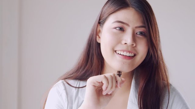 close up of Asian women smile are using work ideas at office