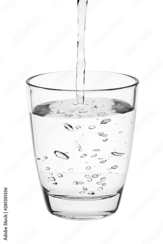 Wall mural water pouring into a tumbler glass isolated on white background. with clipping path.