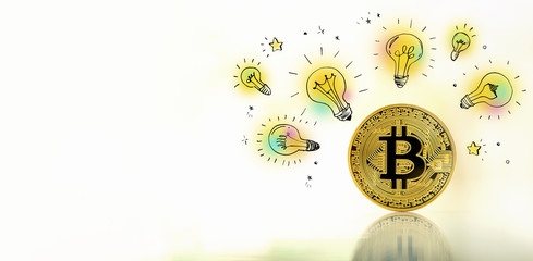 Idea light bulbs with gold bitcoin cryptocurrency coin