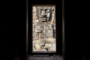 The mystery face tower in Bayon temple the state temple of the Mahayana Buddhist King Jayavarman VII in Siem Reap, Cambodia view from the inside of Bayon sanctuary.