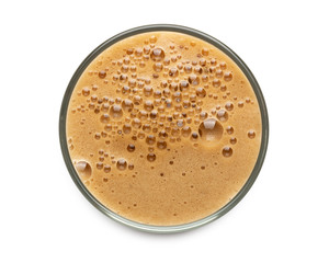 Glass of dark stout beer top view with foam. Isolated on white background. with clipping path.