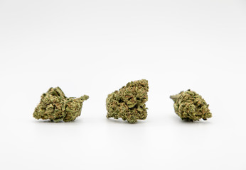 Multiple marijuana buds on white background