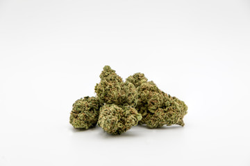 Multiple marijuana buds on white background