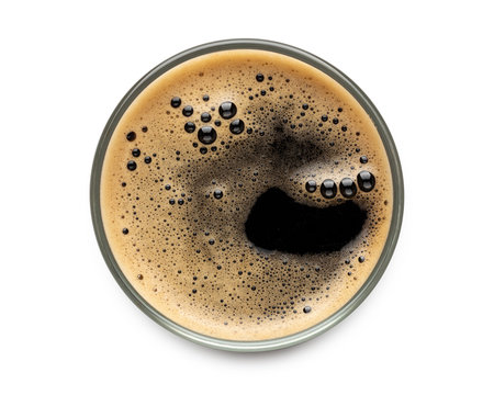 Glass of dark stout beer top view with foam. Isolated on white background. with clipping path. © Freedom Life