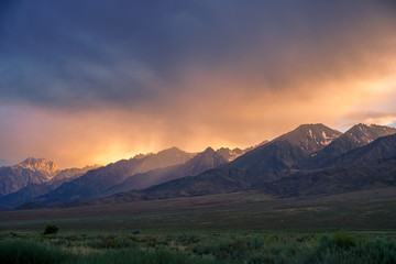 Fototapeta na wymiar Mountain range colorful sunset with clouds before storm , Eastern Sierra Mountains, Mono County, California, USA