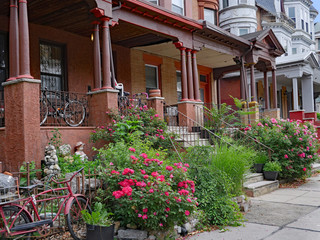 old houses with bicycles on large porches, in a university neighborhood, rented to students