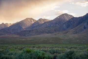 Mountain range colorful sunset with clouds before storm , Eastern Sierra Mountains, Mono County, California, USA
