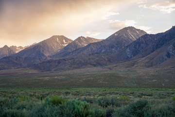 Fototapeta premium Mountain range colorful sunset with clouds before storm , Eastern Sierra Mountains, Mono County, California, USA
