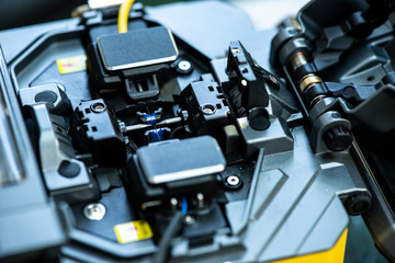 Naklejka premium Device for mounting optical cable. Optical internet Technology concept.