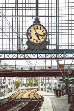 Classic train station clock hanging onto the roof of the old train station 