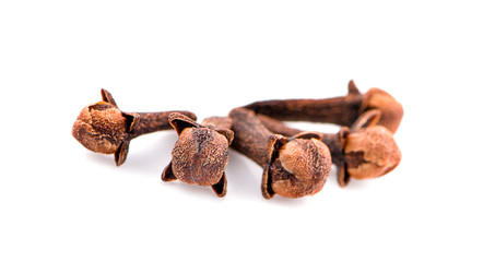 dry cloves on white background
