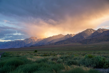 Mountain range colorful sunset with clouds before storm , Eastern Sierra Mountains, Mono County,...