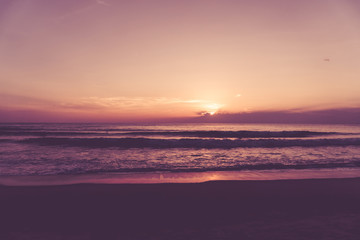 Naklejka premium Tropical nature clean beach and white sand in summer with sun light blue sky and bokeh background.