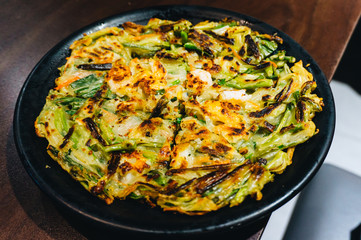 Korean pizza served in a Korean restaurant that is open for sale in Thailand.