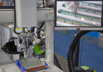 Production of automated robot for print circuit board (PCB) assembly for spot soldering of printed...
