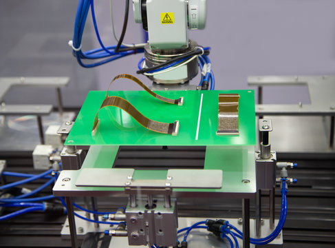 Automated Robot Connecting Flexible Flat Cable FFC On Print Circuit Board (PCB). Electronics Industry